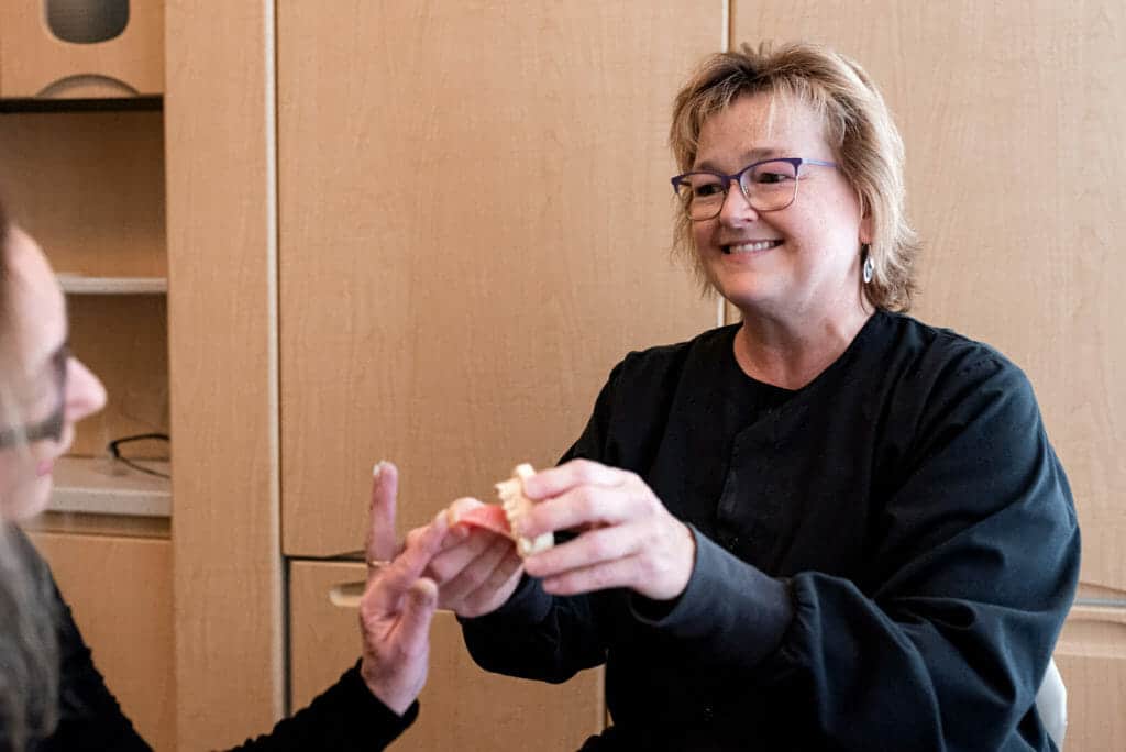 patient touching dental bonding example